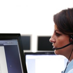 A Crime Stoppers representative takes a call from a member of the public.